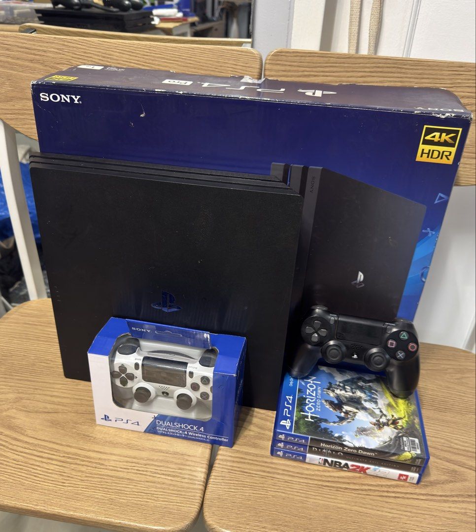 PS4 Pro with 2 controllers and 3 games + box (Category: PlayStation) located in Pasig City. Submitted by robbiseraphin (Listing ID 1453325037, Image 1). Description: Selling: PS4 Pro 1TB with 2 controllers and 3 games ✅ TAKE ALL Inclusives: - PS4 Pro 1tb (never been opened or repaired) - 2 controller (black original, white OEM) - 3 games (horizon zero dawn, nba 2k22, Diablo 3) all used codes - complete wires (HDMI and power chord) - with original