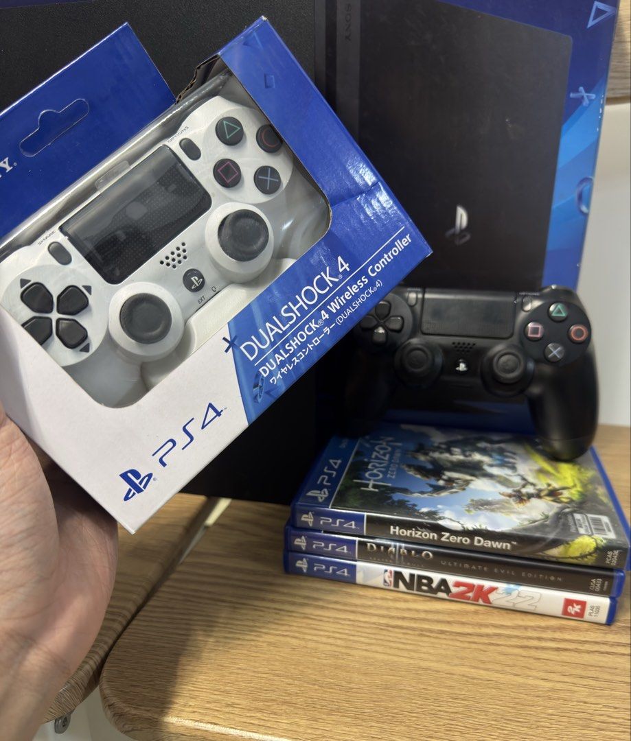 PS4 Pro with 2 controllers and 3 games + box (Category: PlayStation) located in Pasig City. Submitted by robbiseraphin (Listing ID 1453325037, Image 2). Description: Selling: PS4 Pro 1TB with 2 controllers and 3 games ✅ TAKE ALL Inclusives: - PS4 Pro 1tb (never been opened or repaired) - 2 controller (black original, white OEM) - 3 games (horizon zero dawn, nba 2k22, Diablo 3) all used codes - complete wires (HDMI and power chord) - with original