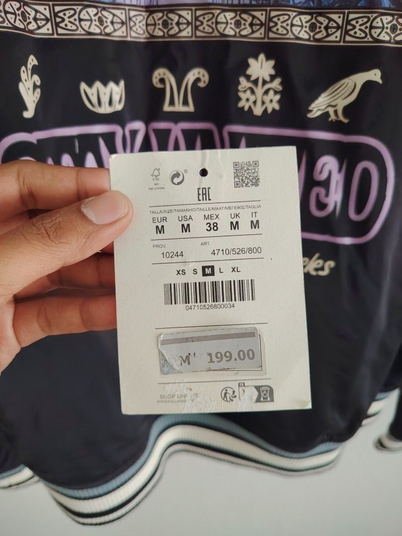 Pull & Bear Jacket (Category: Coats, Jackets and Outerwear) located in Petaling Jaya. Submitted by sywlzm (Listing ID 1453287916, Image 3). Description: Pull & bear jacket - Size: M - "Stay United" graphic on back with palm trees and jellyfish design - Ribbed cuffs and hem - Button-up front - Ideal for casual wear - Condition 9/10, only wore twice - negotiable till let go.