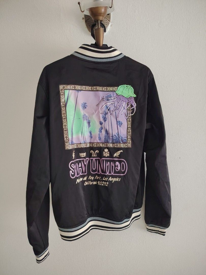 Pull & Bear Jacket (Category: Coats, Jackets and Outerwear) located in Petaling Jaya. Submitted by sywlzm (Listing ID 1453287916, Image 2). Description: Pull & bear jacket - Size: M - "Stay United" graphic on back with palm trees and jellyfish design - Ribbed cuffs and hem - Button-up front - Ideal for casual wear - Condition 9/10, only wore twice - negotiable till let go.