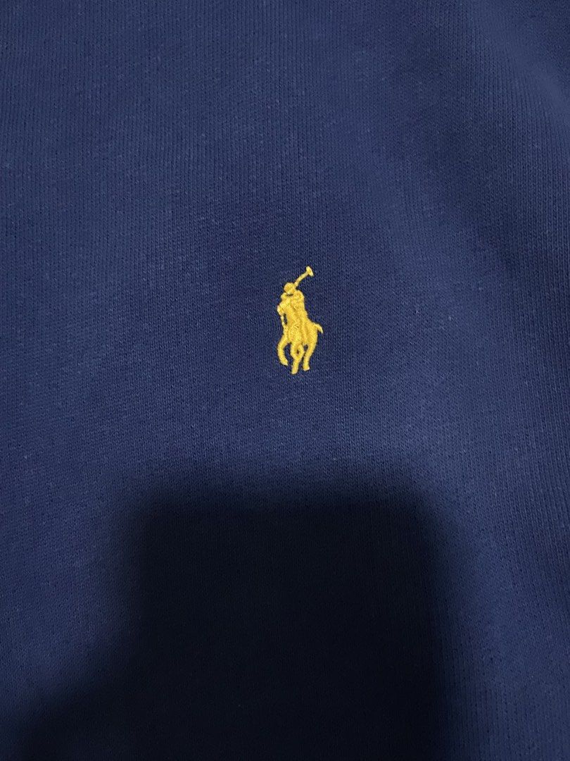 Ralph Lauren Polo Bear Navy Blue Sweatshirt (Category: Activewear) located in Tuguegarao City. Submitted by nero_28 (Listing ID 1453426435, Image 2). Description: - Classic navy blue sweatshirt from Ralph Lauren. - Features the iconic Polo Bear logo embroidered in yellow on the chest. - Made from a comfortable cotton blend. - Great for casual wear. - Tagged size XL..