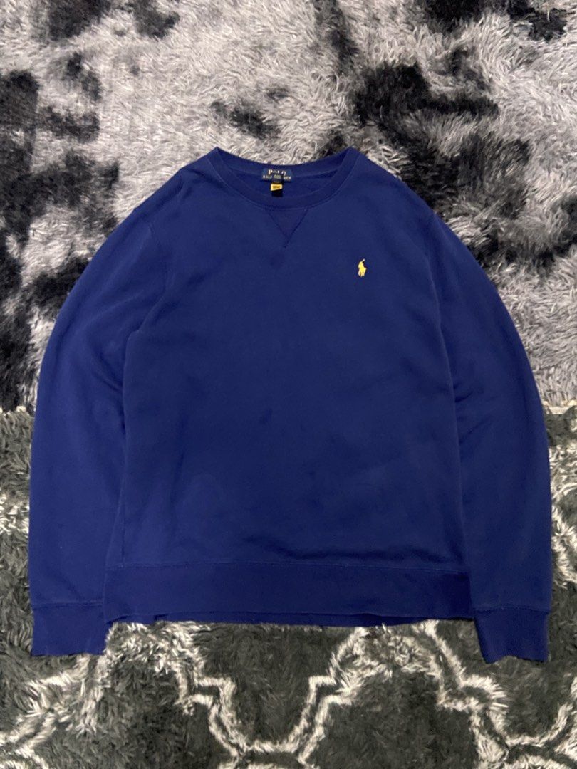Ralph Lauren Polo Bear Navy Blue Sweatshirt (Category: Activewear) located in Tuguegarao City. Submitted by nero_28 (Listing ID 1453426435, Image 1). Description: - Classic navy blue sweatshirt from Ralph Lauren. - Features the iconic Polo Bear logo embroidered in yellow on the chest. - Made from a comfortable cotton blend. - Great for casual wear. - Tagged size XL..