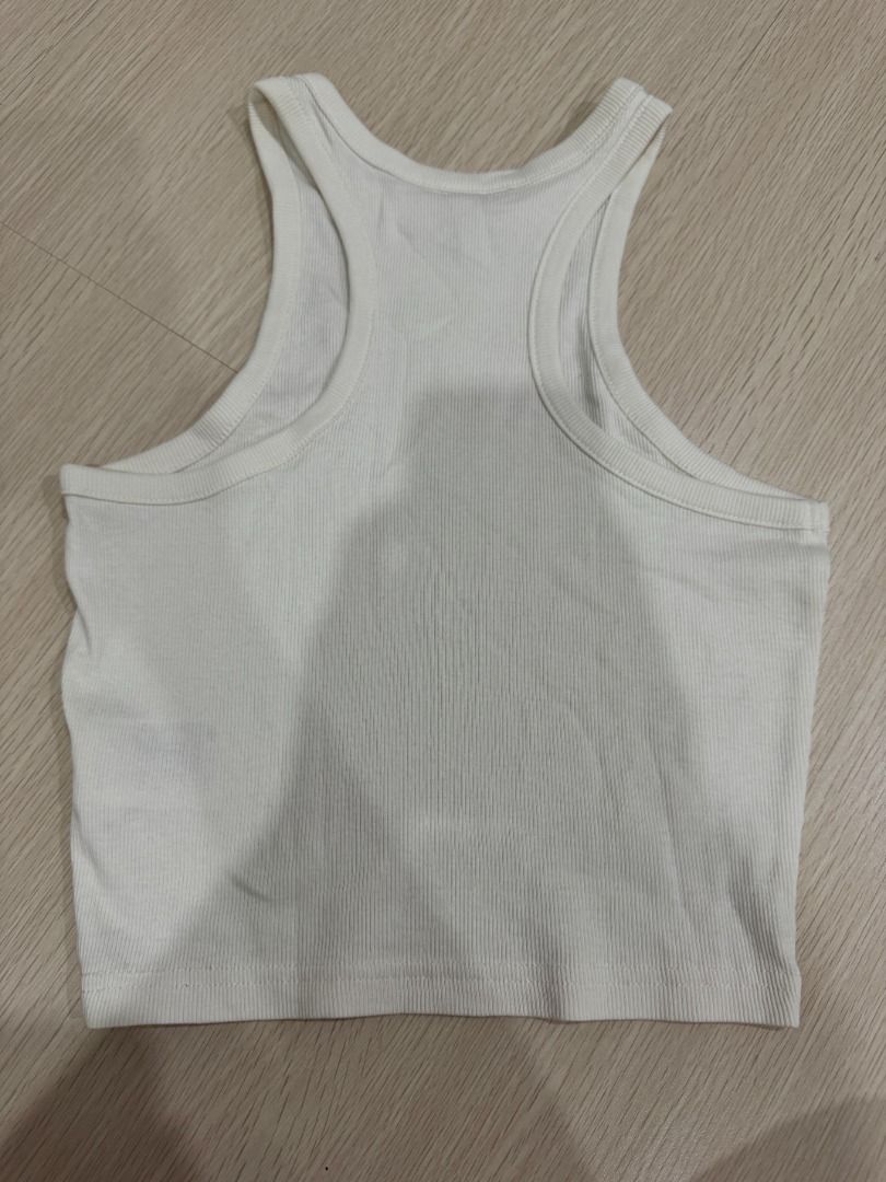 Ribbed Racerback Crop Tank Top Cream (Category: Sleeveless) located in Manila. Submitted by nielas.closet (Listing ID 1453332763, Image 2). Description: - Cream ribbed crop tank top - Racerback style - Stretchy material for a comfortable fit - Best fits size Small to Medium - Versatile basic piece, great for layering or wearing alone.