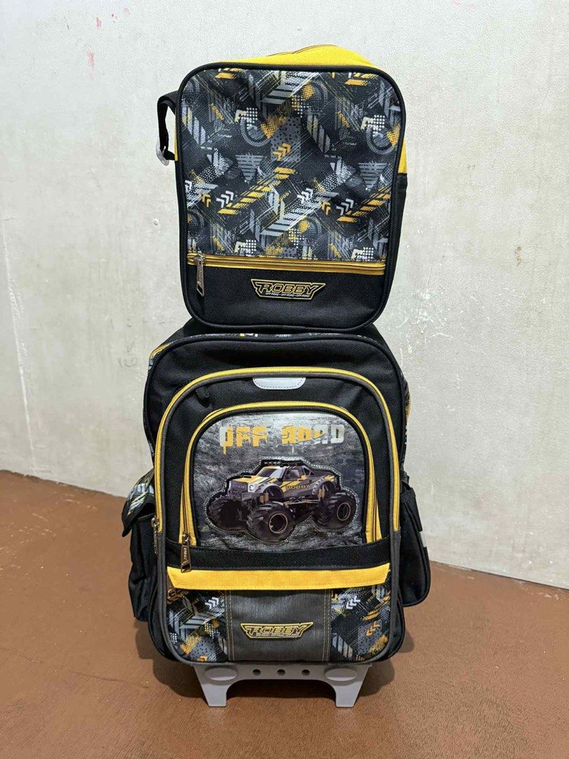 Robby Rabbit trolley school bag (Category: Babies & Kids Fashion) located in Quezon City. Submitted by joyangelique (Listing ID 1453254819, Image 1). Description: size: 31cm L x 16cm W x 41cm H (16inch) • sa mall nabili, orig price is 3,299 • this is brand new, never been used • umiilaw ang gulong • with total of 7 pockets • spacious compartment with 2-way zipper • can be used as backpack, padded backstrap • free pencil case, bottle and rain cove