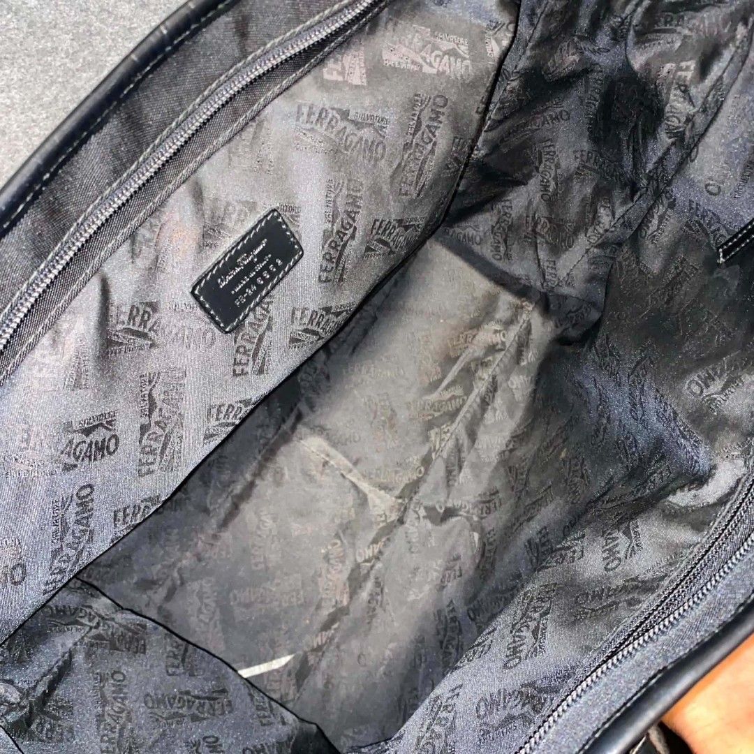Salvatore Ferragamo Black Nylon Leather Bag (Category: Luxury Bags & Wallets) located in Cordova. Submitted by aux.archive (Listing ID 1453404855, Image 3). Description: This black nylon Salvatore Ferragamo handbag features leather handles and a subtle gold-toned brand plaque Large can fit files and laptop Great condition 8000 shipped.