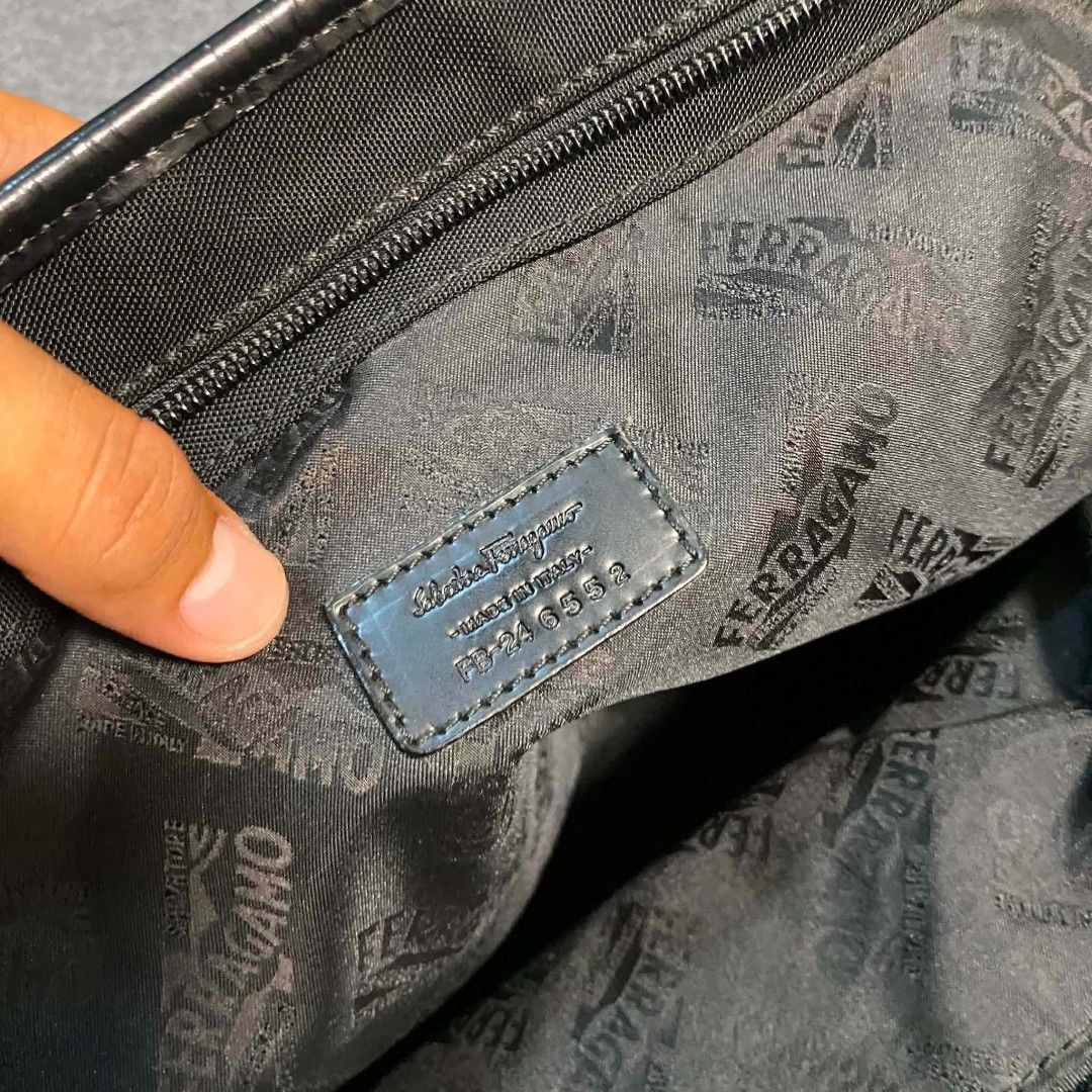 Salvatore Ferragamo Black Nylon Leather Bag (Category: Luxury Bags & Wallets) located in Cordova. Submitted by aux.archive (Listing ID 1453404855, Image 2). Description: This black nylon Salvatore Ferragamo handbag features leather handles and a subtle gold-toned brand plaque Large can fit files and laptop Great condition 8000 shipped.