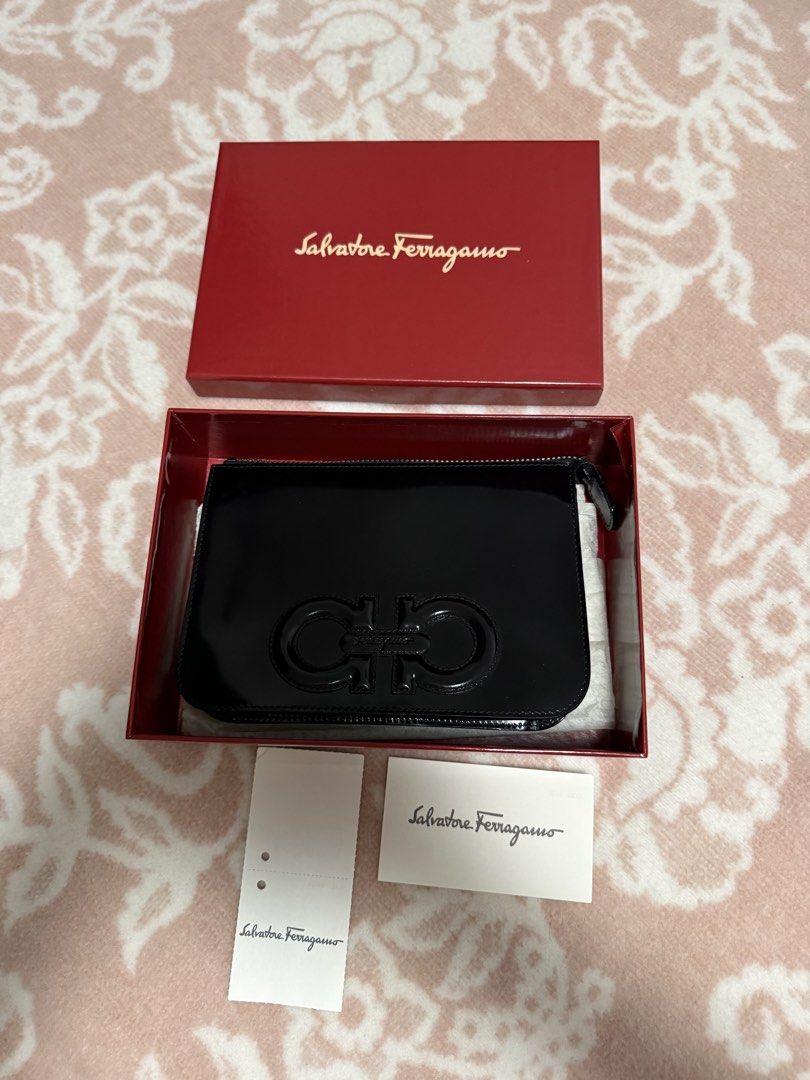 Salvatore Ferragamo Hand Bag (Category: Luxury Bags & Wallets) located in Quezon City. Submitted by liezl.marie (Listing ID 1453391019, Image 1). Description: Authentic Salvat0r€ Ferr@gam0 Patent Leather Zip Handbag/clutch complete with its original box and brand cards. 6,500 Open for layaway. Disclaimer: We are not affiliated, associated, authorized, endorsed by or in any way officially connected with any other company or luxury brand. All copyr