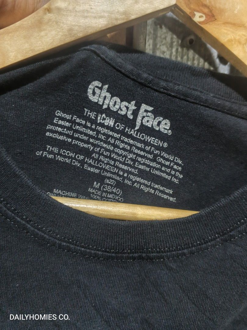 Scream Ghost Face Tee Size ( M ) (Category: Tshirts & Polo Shirts ) located in Manila. Submitted by dailyhomiescollection (Listing ID 1453258230, Image 3). Description: The "Scream's Ghost Face Tee" is a black T-shirt featuring a graphic print of the iconic Ghost Face character from the Halloween Horror Scream Movies. Made from a cotton blend material, this crew neck shirt has short sleeves and a regular fit in size L. It is machine washable and 