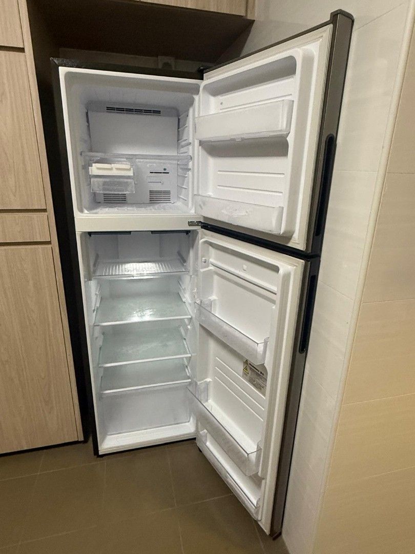 Sharp Refrigerator (Category: Refrigerators & Freezers) located in Singapore. Submitted by skyriderx (Listing ID 1451270876, Image 3). Description: - Sharp Refrigerator - Stainless Steel Finish - Two Doors (Top Freezer) - Energy Efficient - Works Well - Selling due to relocation - 3 years old.