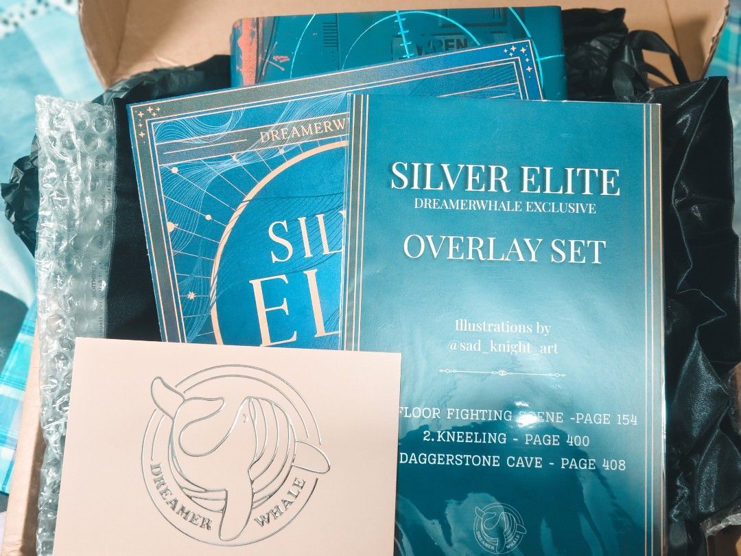 Silver Elite Dreamerwhale Exclusive Edition Book Set (Category: Storybooks) located in Baguio. Submitted by selover1492 (Listing ID 1453365446, Image 3). Description: - Exclusive Silver Elite Dreamerwhale Edition book - Includes black drawstring bag - Features overlay set with illustrations by @sad_knight_art - Edgy design with graffiti and wolf - Ideal for collectors.
