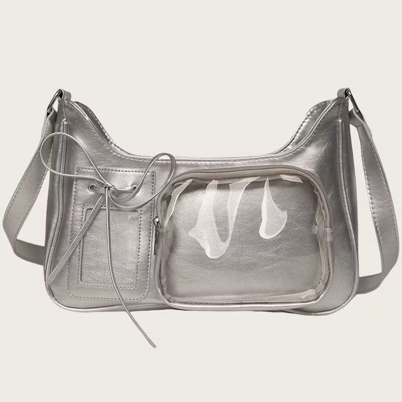 Silver Shoulder Concert Bag with Clear Front Pocket (Category: Shoulder Bags) located in Manila. Submitted by chizym (Listing ID 1453372070, Image 1). Description: - Cool silver shoulder bag - Clear front pocket perfect for displaying pins or charms - Smaller pocket with drawstring closure - Zippered main compartment - Adjustable strap - Ideal for Y2K or streetwear fashion - Needs cleaning.