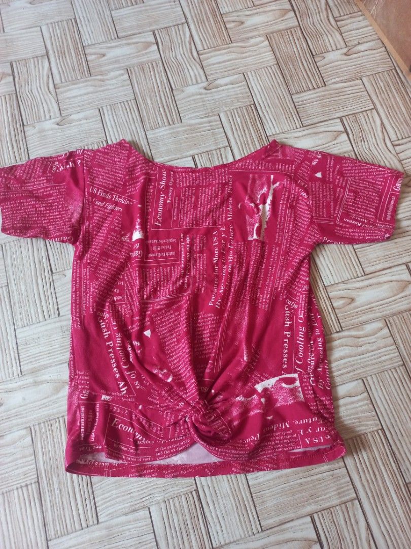 Small Tie T-Shirt with Newspaper Print (Category: Shirts) located in Rizal. Submitted by magi_declutters (Listing ID 1453419991, Image 1). Description: - Trendy pink t-shirt with all-over newspaper print - Features a stylish tie detail at the front - Size: Small - Ideal for a chic and casual everyday look.