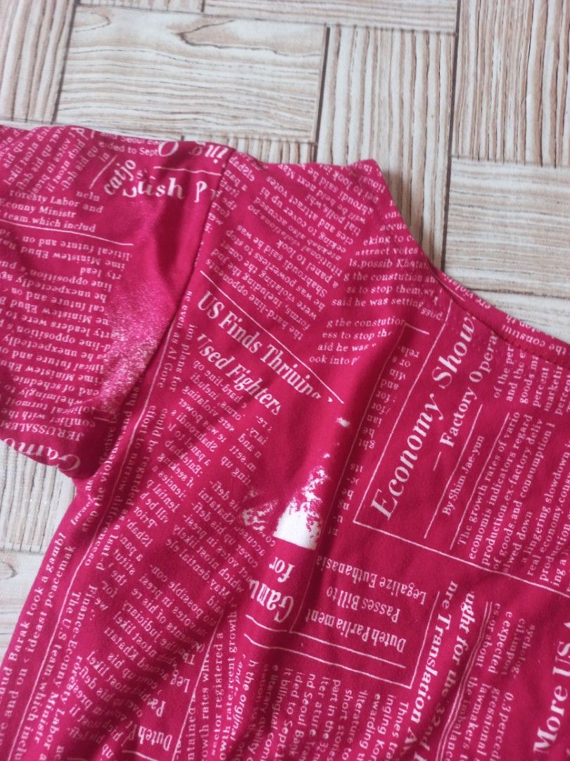 Small Tie T-Shirt with Newspaper Print (Category: Shirts) located in Rizal. Submitted by magi_declutters (Listing ID 1453419991, Image 2). Description: - Trendy pink t-shirt with all-over newspaper print - Features a stylish tie detail at the front - Size: Small - Ideal for a chic and casual everyday look.
