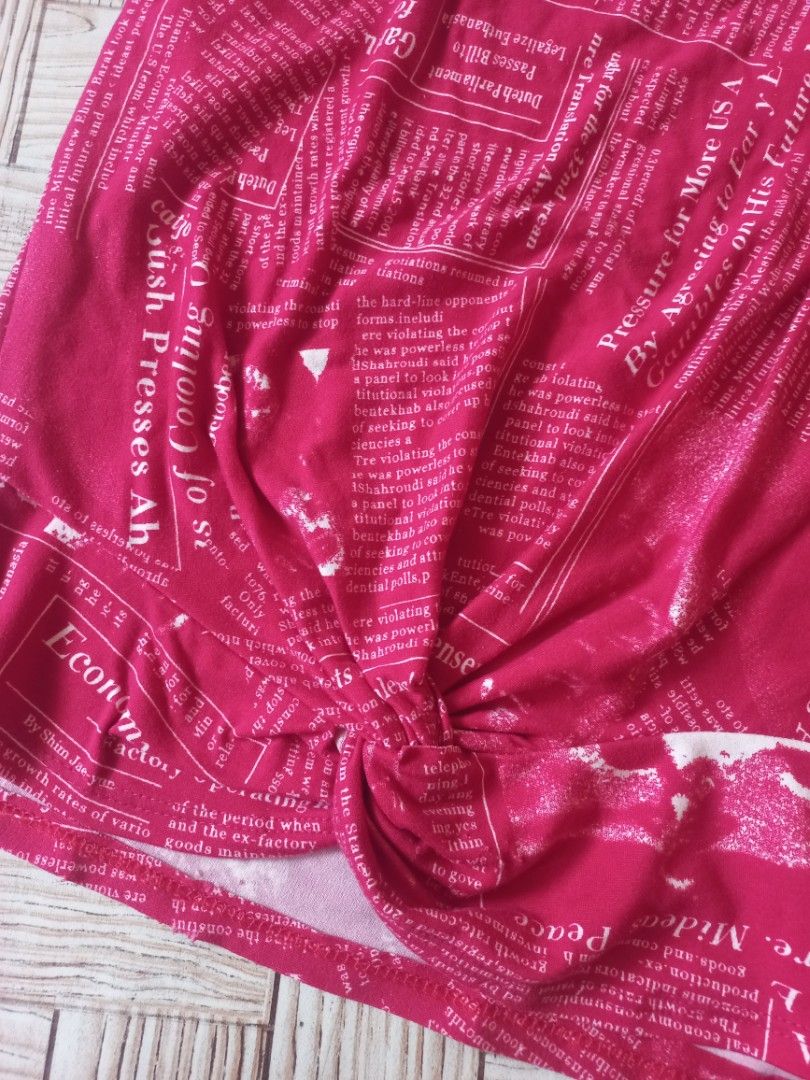 Small Tie T-Shirt with Newspaper Print (Category: Shirts) located in Rizal. Submitted by magi_declutters (Listing ID 1453419991, Image 3). Description: - Trendy pink t-shirt with all-over newspaper print - Features a stylish tie detail at the front - Size: Small - Ideal for a chic and casual everyday look.
