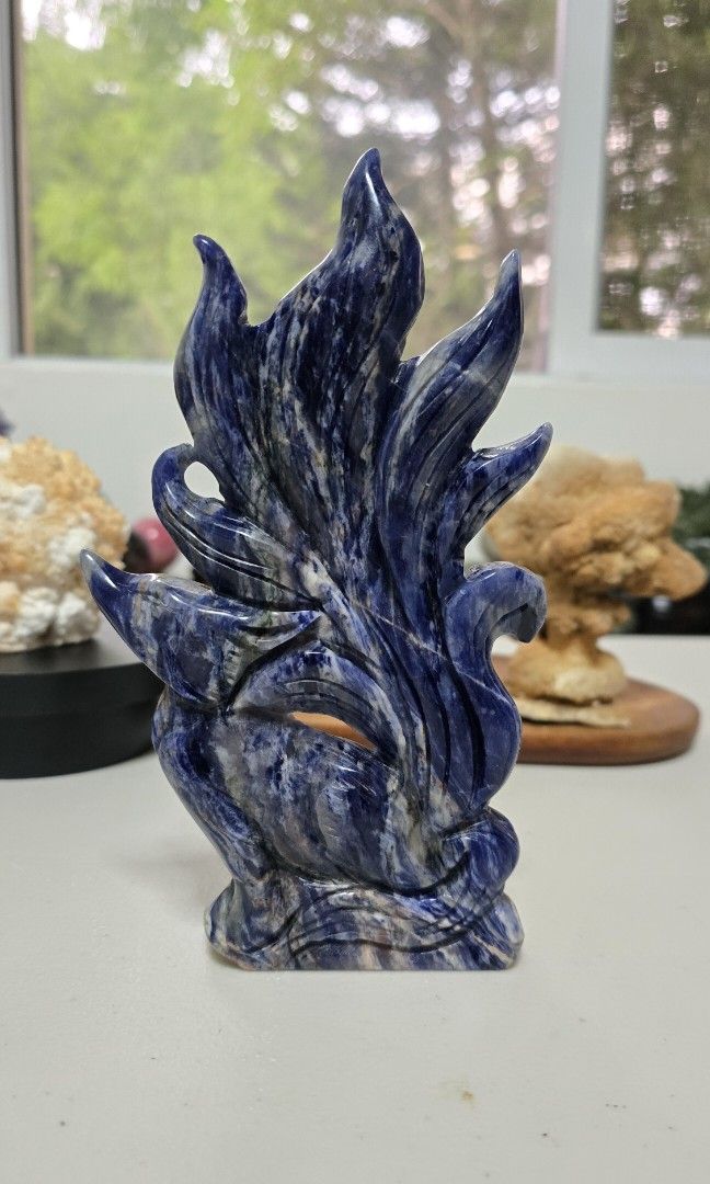Sodalite Nine Tailed Fox Carving (Category: Precious Stones) located in Taguig. Submitted by c_rivera (Listing ID 1453371347, Image 2). Description: sodalite benefits: Mental clarity: Clears confusion and helps focus the mind on truth and logic. Stress relief: Calms panic attacks, releases anxiety, and quiets a racing mind. Boosts confidence: Strengthens self-esteem and encourages you to trust your own instincts. Calming workspaces: Placed on a d