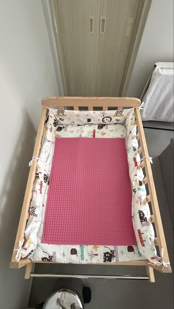 Solid Wood Changing Table (Category: Changing Tables & Stations) located in Singapore. Submitted by _lessismore (Listing ID 1453308041, Image 4). Description: Simple changing table with pad. perfect height, stable countertop, soft odorless pad, large easy-access storage for diapers and wipes, plus a towel bar. Lucky Baby rubber sheet fits the table perfectly (not included)..