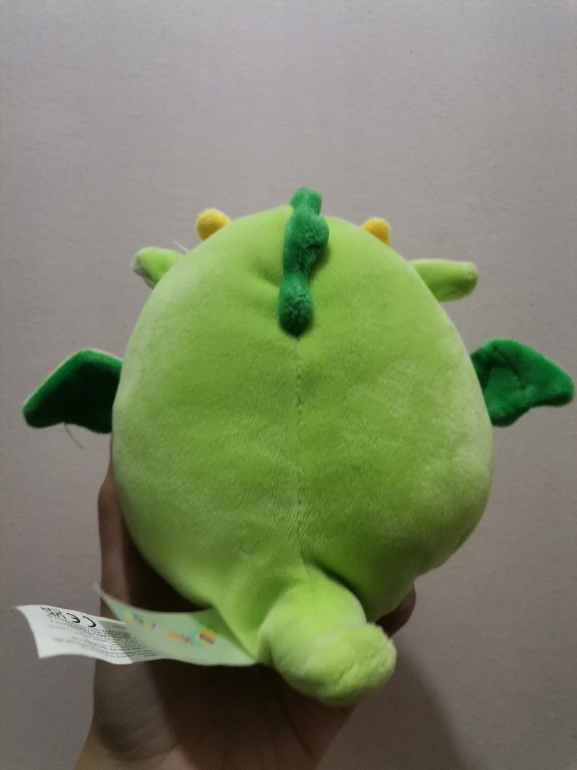 Squishmallows Green Dragon Plush Toy (Category: Plushies & Soft Toys) located in Makati City. Submitted by kookybearsstuff (Listing ID 1453333687, Image 2). Description: - Adorable green dragon plush toy from Squishmallows. - Super soft and squishy, ideal for hugs. - Features cute little wings and yellow horns. - Perfectly sized for children. - A must-have addition to any Squishmallow collection!.