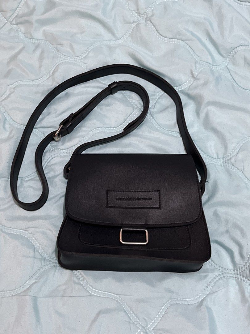 Straightforward Crossbody Bag (Category: Cross-body Bags) located in Makati City. Submitted by mighty.avery (Listing ID 1453393417, Image 1). Description: RFS: Decluttering No issues, good as new - Secure flap closure with stylish metal buckle - Adjustable strap for a customized fit - Interior magnetic snap closures for added security.