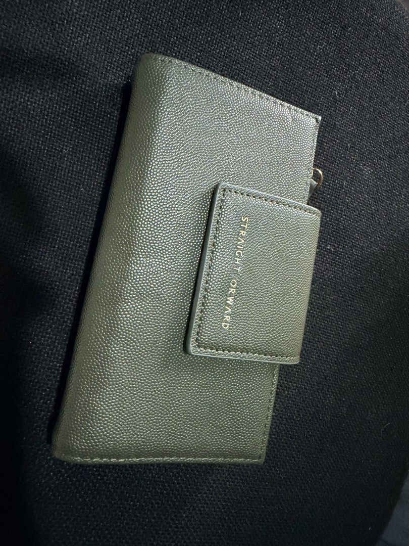 Straightforward Olive Green Tri-Fold Wallet (Category: Wallets & Card holders) located in Quezon City. Submitted by forever_chic (Listing ID 1453291730, Image 1). Description: Straight Forward DVL HESTIA wallet RFS: Not using Minor flaw: check photo natanggal ung letters What you is what you get Actual photo posted - Stylish olive green tri-fold wallet - Multiple card slots and clear ID window - Secure zippered coin compartment - Elegant gold har