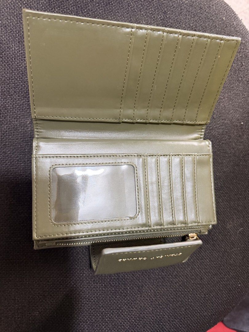 Straightforward Olive Green Tri-Fold Wallet (Category: Wallets & Card holders) located in Quezon City. Submitted by forever_chic (Listing ID 1453291730, Image 2). Description: Straight Forward DVL HESTIA wallet RFS: Not using Minor flaw: check photo natanggal ung letters What you is what you get Actual photo posted - Stylish olive green tri-fold wallet - Multiple card slots and clear ID window - Secure zippered coin compartment - Elegant gold har