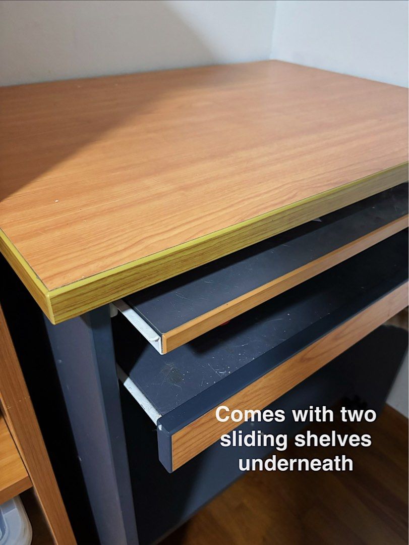 Study Computer Desk (Category: Tables & Sets) located in Singapore. Submitted by countthelove (Listing ID 1453375502, Image 2). Description: - Compact wooden desk - 2 sliding shelves for storage - Equipped with wheels for easy mobility - Ideal for small workspaces or study areas - Dimensions: 76cm (L) x 57cm (W) x 80cm (H) - In excellent condition Self collection at CCK/Yewtee area. Exact address will be provided once deal is confirmed. .