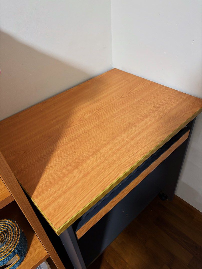 Study Computer Desk (Category: Tables & Sets) located in Singapore. Submitted by countthelove (Listing ID 1453375502, Image 3). Description: - Compact wooden desk - 2 sliding shelves for storage - Equipped with wheels for easy mobility - Ideal for small workspaces or study areas - Dimensions: 76cm (L) x 57cm (W) x 80cm (H) - In excellent condition Self collection at CCK/Yewtee area. Exact address will be provided once deal is confirmed. .