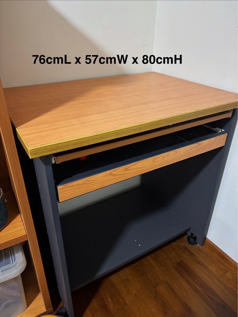 Study Computer Desk (Category: Tables & Sets) located in Singapore. Submitted by countthelove (Listing ID 1453375502, Image 1). Description: - Compact wooden desk - 2 sliding shelves for storage - Equipped with wheels for easy mobility - Ideal for small workspaces or study areas - Dimensions: 76cm (L) x 57cm (W) x 80cm (H) - In excellent condition Self collection at CCK/Yewtee area. Exact address will be provided once deal is confirmed. .