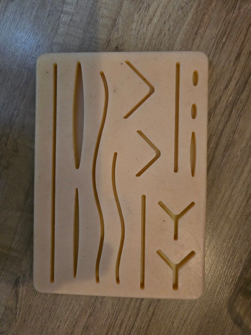Surgical Suture Practice Pad for Medical Training (Category: Medical Supplies & Tools) located in Caloocan City. Submitted by mluck (Listing ID 1453427428, Image 1). Description: - Silicone suture practice pad with various cuts and shapes - Ideal for learning and practicing different suturing techniques - Durable and reusable material - Comes in a convenient pink case - Perfect for medical students and aspiring healthcare professionals.