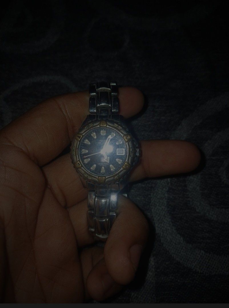 Swiss Military 100M Automatic Diver-Style Watch (Category: Men's Watches) located in Batac City. Submitted by silvercrystal_fd03a9 (Listing ID 1453395979, Image 3). Description: Vintage Swiss Military automatic watch featuring a dark black dial, luminous indices, date window at 3 o'clock, and a two-tone accent bezel with stainless steel bracelet. Classic rugged military design built for daily wear. ​Brand: Swiss Military ​Movement: Automatic ​Wat
