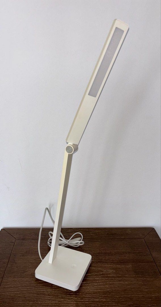 table light (Category: Lighting) located in Singapore. Submitted by liuxue3918 (Listing ID 1453332461, Image 2). Description: - Sleek, modern white desk lamp - Adjustable arm for customizable light direction - Minimalist and clean design - Ideal for study, work, or bedside use - Enhances any workspace with its contemporary aesthetic.