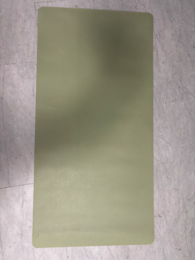 Table mat (Category: Carpets & Mats) located in Singapore. Submitted by shalom_7 (Listing ID 1453394520, Image 1). Description: - Rectangular cutting board - Light green color - Made of plastic or similar material - Ideal for food preparation - Easy to clean - Suitable for kitchen use.