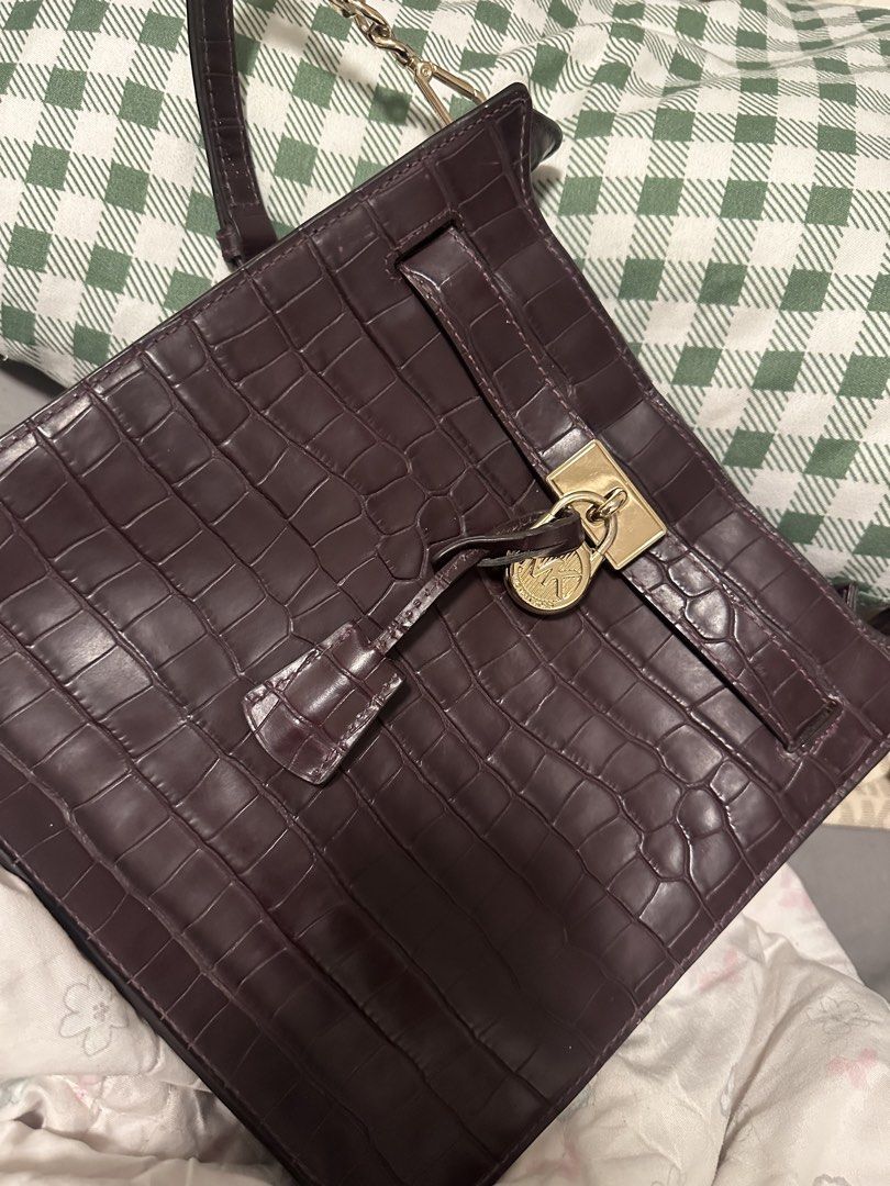 TAKE 2 Michael Kors Monogrammed Satchel Bag (Category: Luxury Bags & Wallets) located in Santa. Submitted by frinkmallooo (Listing ID 1453421642, Image 1). Description: - 101% Authentic Michael Kors cream and beige monogram satchel - Tan leather accents and gold hardware - Zipper closure - Detachable charm included - Bonus: Dark brown croc-embossed handbag with gold hardware and lock closure - Both bags feature interior pockets Take both for 1550