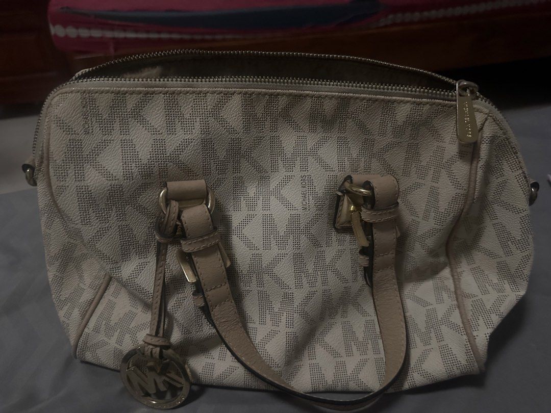 TAKE 2 Michael Kors Monogrammed Satchel Bag (Category: Luxury Bags & Wallets) located in Santa. Submitted by frinkmallooo (Listing ID 1453421642, Image 2). Description: - 101% Authentic Michael Kors cream and beige monogram satchel - Tan leather accents and gold hardware - Zipper closure - Detachable charm included - Bonus: Dark brown croc-embossed handbag with gold hardware and lock closure - Both bags feature interior pockets Take both for 1550