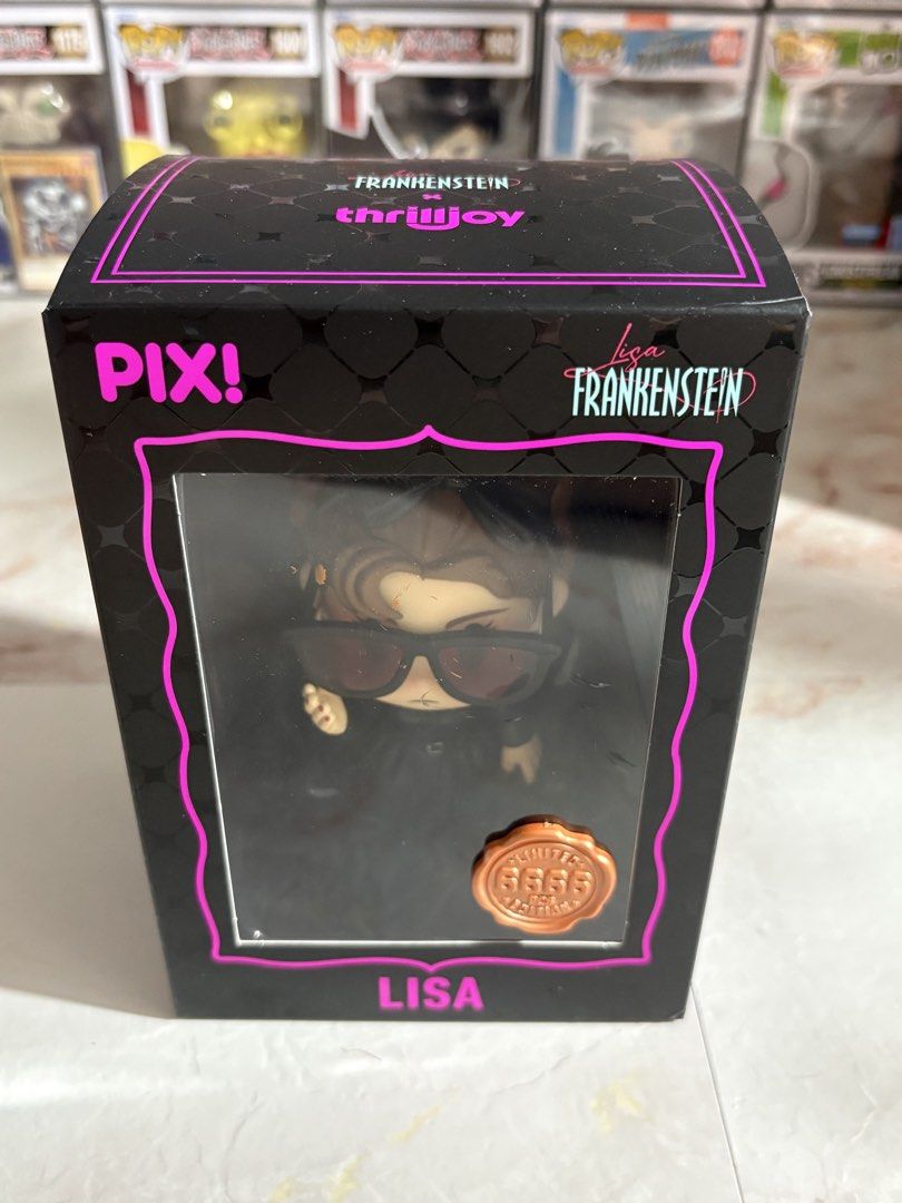 Thrilljoy Lisa Frankenstein x Thrilljoy PIX! Figure (Category: Designer & Blind Box Toys) located in Manila. Submitted by 120collectiblesbyrjtt (Listing ID 1453423385, Image 1). Description: - Lisa Frankenstein x Thrilljoy PIX! figure - Comes in original box - Box features a cool black and pink design - A unique collectible item.