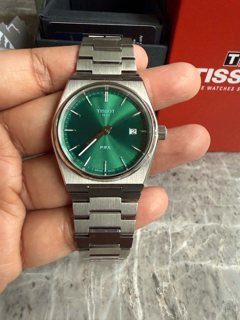 Tissot PRX Green Dial Watch (Category: Luxury Watches) located in Quezon City. Submitted by rhonadc (Listing ID 1453248923, Image 2). Description: - Tissot PRX Watch - Beautiful Green Dial - Stainless Steel Bracelet - Original Box Included - Warranty Card Included - Versatile for everyday or special occasions - Price is negotiable.