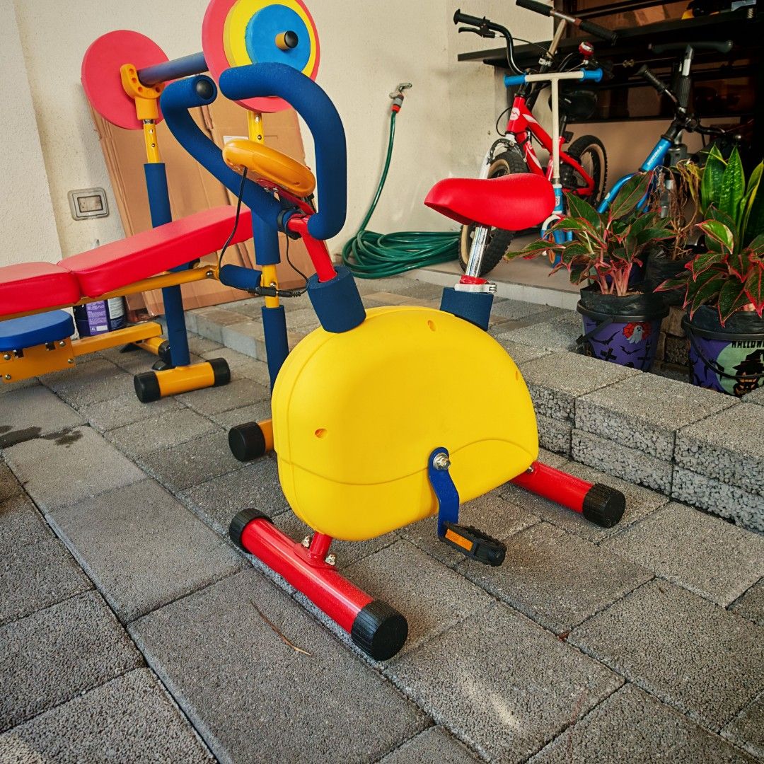 Toddler Home Gym Set (Category: Cardio & Fitness Machines) located in Manila. Submitted by declutterauntie (Listing ID 1453248603, Image 3). Description: - Toddler Home Gym Set - Includes: Weight bench with barbell holders, Yellow exercise bike, Rowing machine - Sturdy and colorful construction - Fun and delightful home kids workouts.