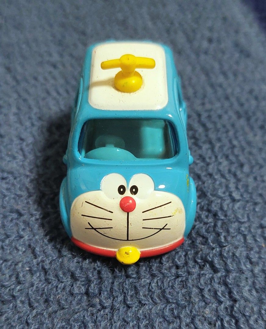 Tomica Doraemon Car 2017 (Category: Vehicle & Diecast Models) located in Baguio. Submitted by ayra1523 (Listing ID 1453366852, Image 1). Description: - Cute Doraemon Tomica car - Made in Vietnam (2017) - Perfect for Doraemon fans and collectors - Ideal for display or play - Shows minor signs of wear.
