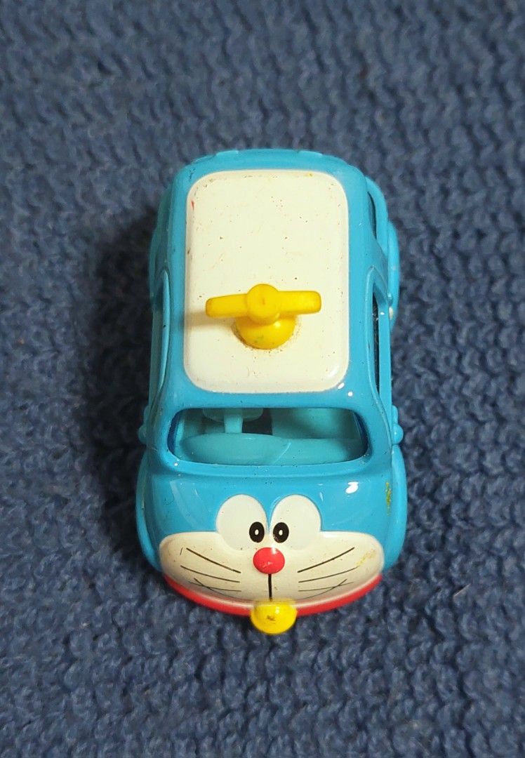 Tomica Doraemon Car 2017 (Category: Vehicle & Diecast Models) located in Baguio. Submitted by ayra1523 (Listing ID 1453366852, Image 2). Description: - Cute Doraemon Tomica car - Made in Vietnam (2017) - Perfect for Doraemon fans and collectors - Ideal for display or play - Shows minor signs of wear.