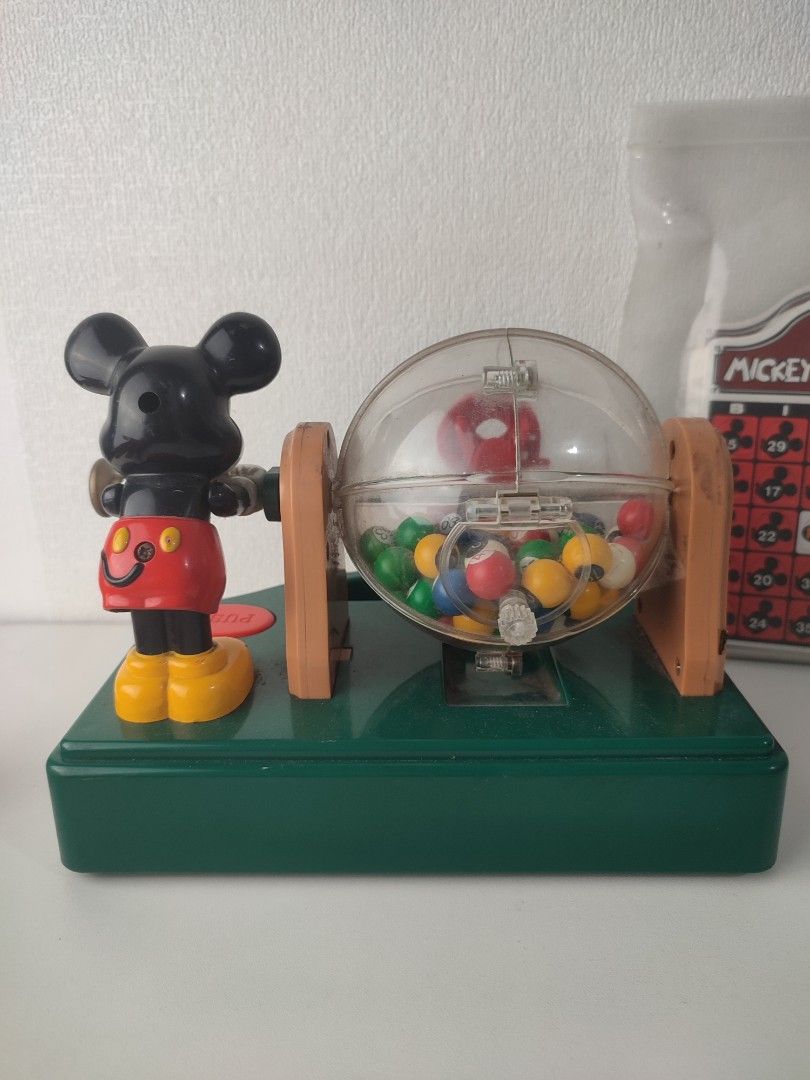 Tomy Mickey Mouse Bingo Party Game (Category: Board Games & Puzzles) located in Manila. Submitted by epicmountain-f20453 (Listing ID 1453273570, Image 2). Description: - Fun Mickey Mouse Bingo Party game by Tomy. - 1 missing ball - Comes with bingo machine, Mickey figure, and bingo cards. - Features a clear ball dispenser and push button. - Ideal for family game nights. - Batteries not included..