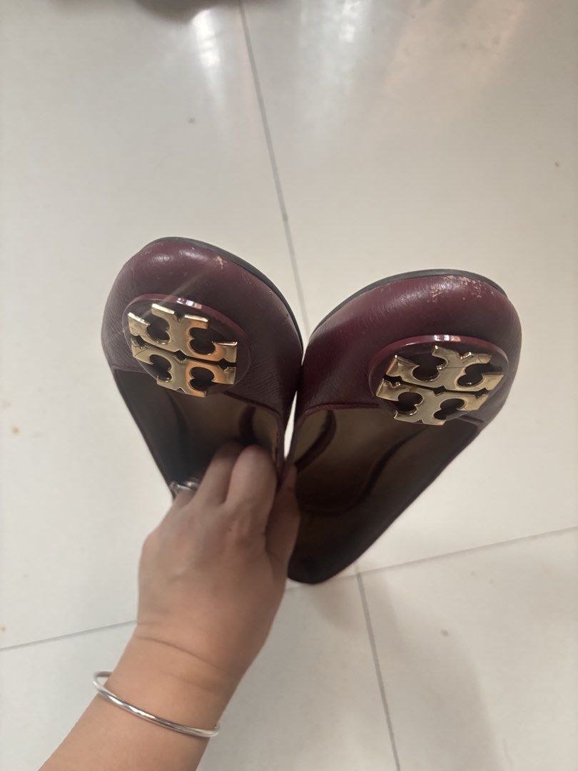 Tory Burch Burgundy Leather Ballet Flats (Category: Flats & Sandals) located in Cabanatuan. Submitted by ligen_dl (Listing ID 1453242314, Image 3). Description: - Burgundy leather Tory Burch ballet flats - Features classic gold Tory Burch logo on the toe - Slip-on style for easy wear - Soles show some signs of wear - Insoles have some marks - Ideal for everyday use.