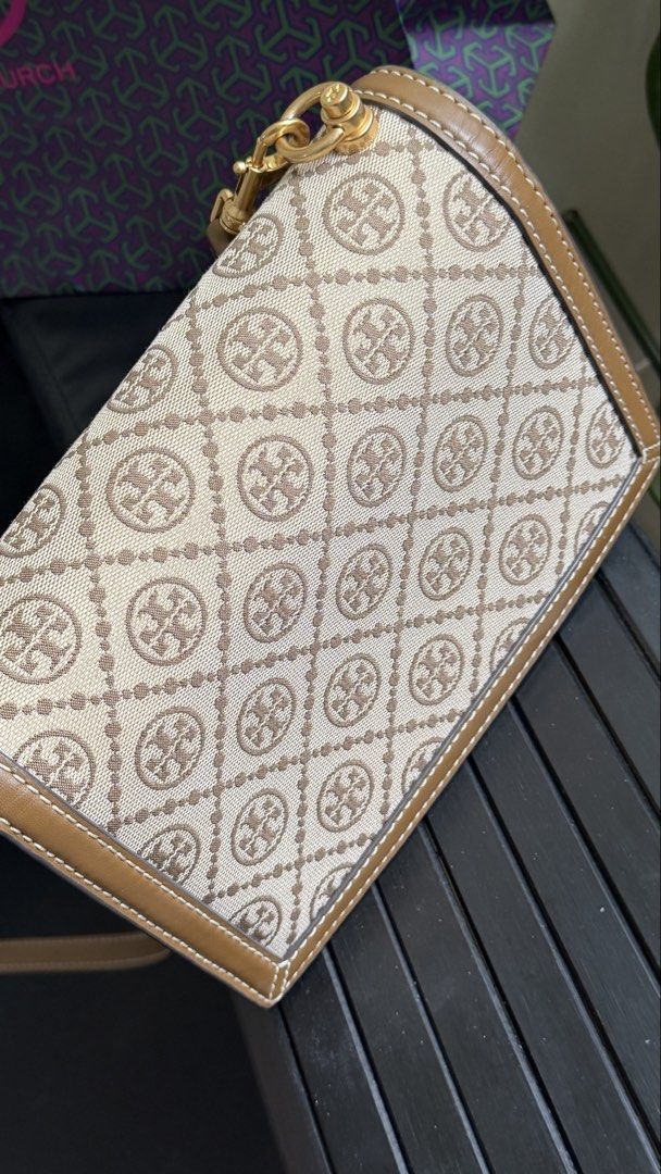 Tory Burch T Monogram (Category: Luxury Bags & Wallets) located in Pasay City. Submitted by shop.jes (Listing ID 1453269251, Image 2). Description: Comes with dustbag,paperbag, 2 original slim and guitar string, and 2 chain sling bought from online shop. Delivery only, no meet up. Thanks.