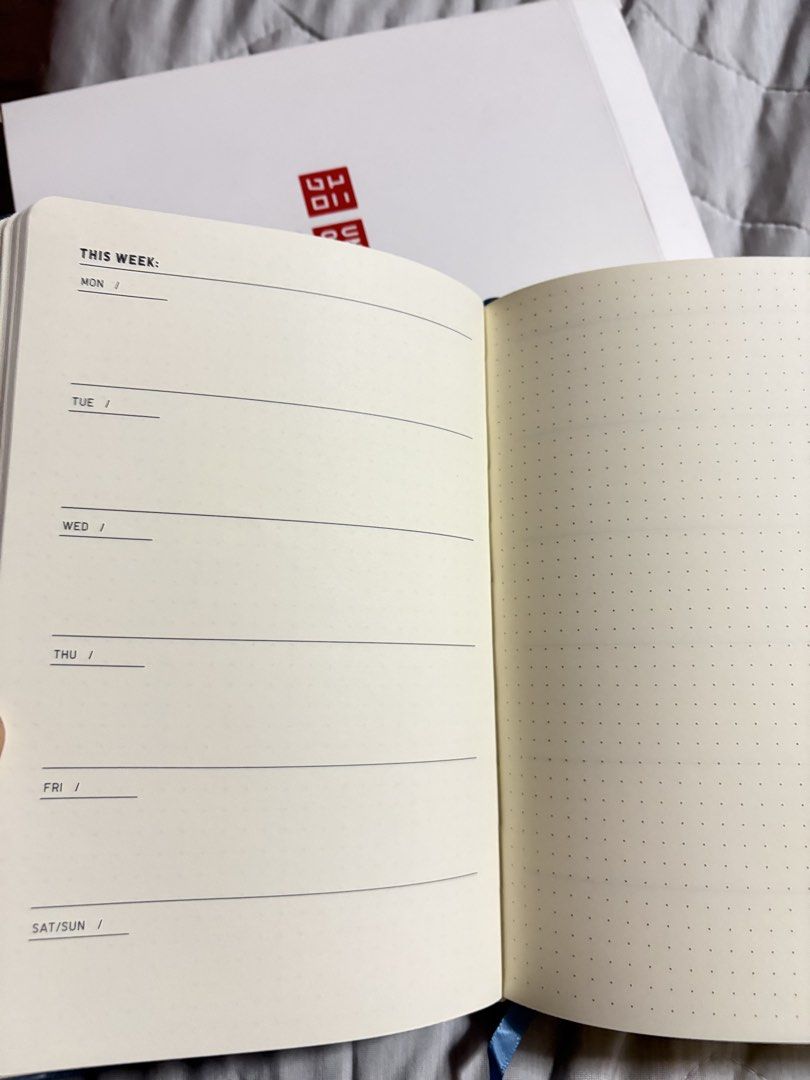 Uniqlo Notebook Undated Planner (Category: Stationery & School Supplies) located in Malabon City. Submitted by jinisells (Listing ID 1453373704, Image 2). Description: - Uniqlo Notebook - Includes original box - Features a weekly planner layout on one side - Dotted pages on the other side - Secure elastic band closure - Ideal for daily planning and journaling 200 each Available in blue and brown.