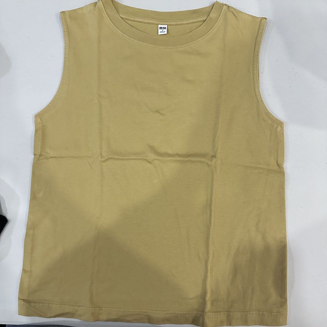 Uniqlo Yellow Sleeveless Top (Category: Sleeveless) located in Bulacan. Submitted by notalyk (Listing ID 1453344046, Image 1). Description: - with freebie (2 items and up) 💗 📍Bulacan Delivery fee is shouldered by customer .