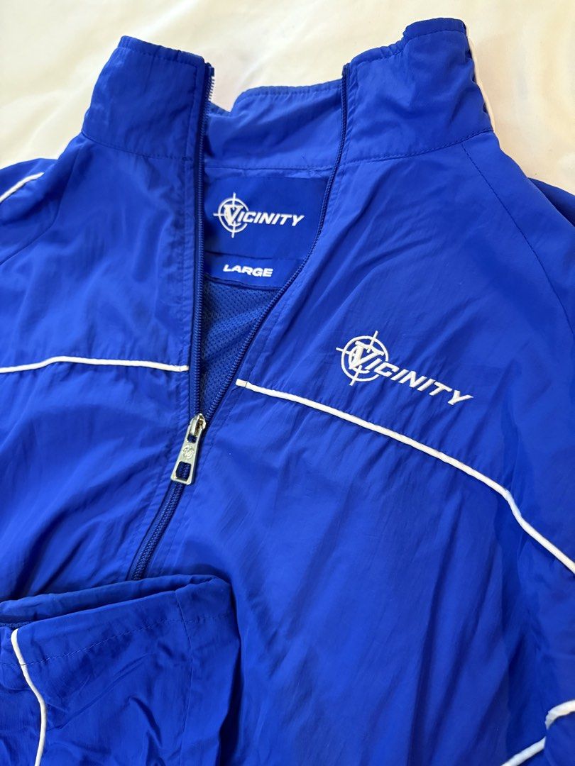 Vicinity Blue Tracksuit Set (Category: Sets & Coordinates) located in Cavite. Submitted by clienmusic67771 (Listing ID 1453329561, Image 2). Description: Blue Vicinity Tracksuit Set Size Large Details: - 100% NYLON - WATERPROOF FABRIC - VICINITY EMBROIDERIES AT FRONT AND BACK - WHITE PIPING - ADJUSTABLE WAISTBAND - ZIPPER POCKETS - INSIDE MESH LINING - V-LOGO ZIPPER PULLER - INSIDE POCKET ON THE LEFT - VICINITY TAG ON THE LEFT .
