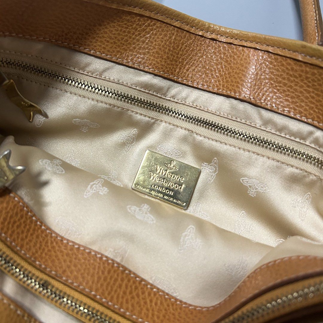 Vivienne Westwood Leather Tote Bag (Authentic) (Category: Luxury Bags & Wallets) located in Pandi. Submitted by davidsorianooo917 (Listing ID 1453393231, Image 3). Description: Vivienne Westwood Leather Tote Bag This Vivienne Westwood Leather Tote is an authentic, vintage piece crafted from grained leather. It features the brand’s iconic embossed orb logo prominently displayed on the front, accompanied by sturdy dual top handles and pointed leath