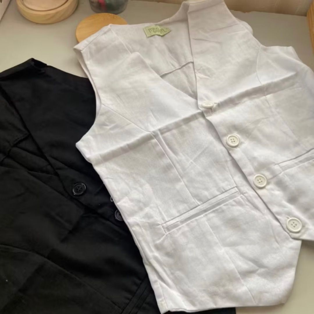 White Linen Vest Top (Category: Vests) located in Paranaque City. Submitted by yanie.ae (Listing ID 1453330714, Image 2). Description: - Classic white vest - V-neckline - Button-up front - Two front pockets - Versatile for layering or standalone wear - Ideal for smart casual or formal outfits.