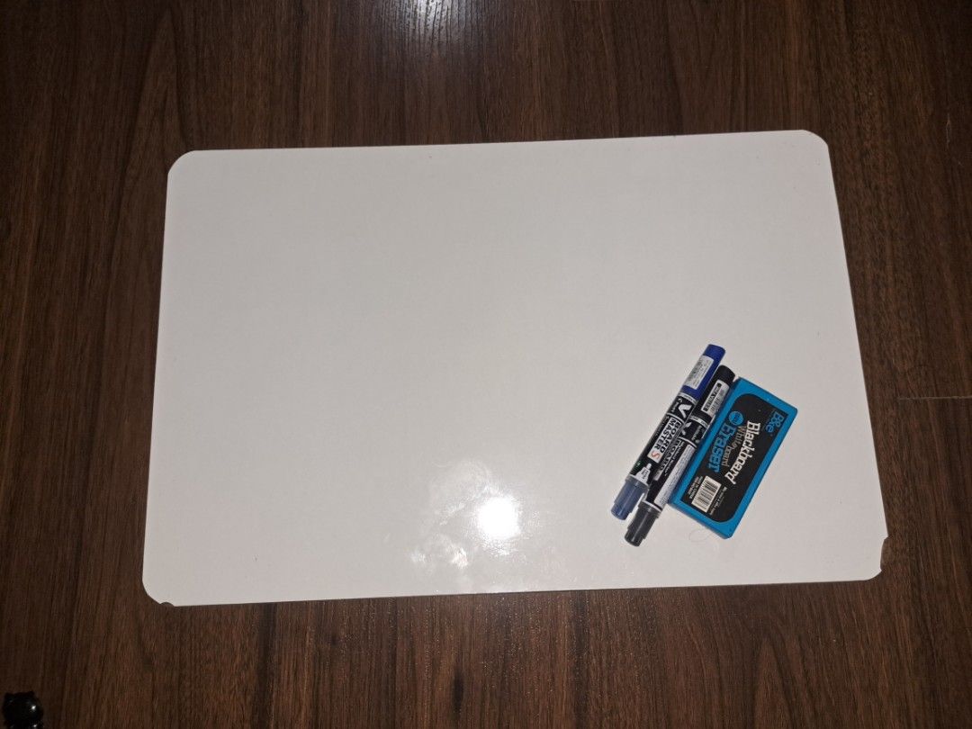 Whiteboard (reusable pilot markers and eraser included) (Category: Stationery & School Supplies) located in Manila. Submitted by sael__ (Listing ID 1453329134, Image 1). Description: -30cmx45.5cm - Compact whiteboard, perfect for quick notes and reminders. - Includes two Pilot brand markers (one blue, one black). - Comes with a small blue eraser. - Features an easy-to-wipe clean surface..
