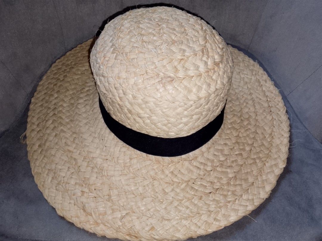 Wide Brim Straw Hat with Black Ribbon (Category: Hats & Beanies) located in Binangonan. Submitted by yuristalin888 (Listing ID 1453325604, Image 3). Description: - Classic straw hat with a wide brim - Features a simple black ribbon band - Provides excellent sun protection - Stylish accessory for any outfit - Visible straw weave detail - Ideal for beach days or casual outings.