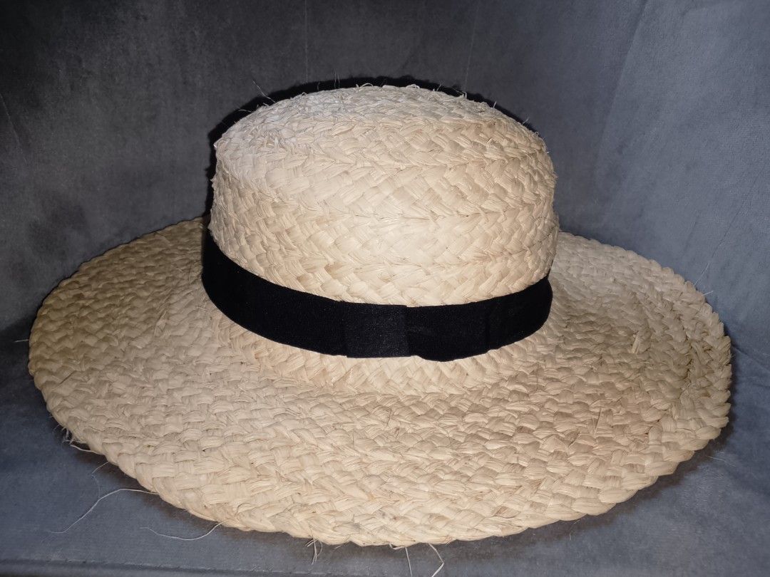 Wide Brim Straw Hat with Black Ribbon (Category: Hats & Beanies) located in Binangonan. Submitted by yuristalin888 (Listing ID 1453325604, Image 2). Description: - Classic straw hat with a wide brim - Features a simple black ribbon band - Provides excellent sun protection - Stylish accessory for any outfit - Visible straw weave detail - Ideal for beach days or casual outings.