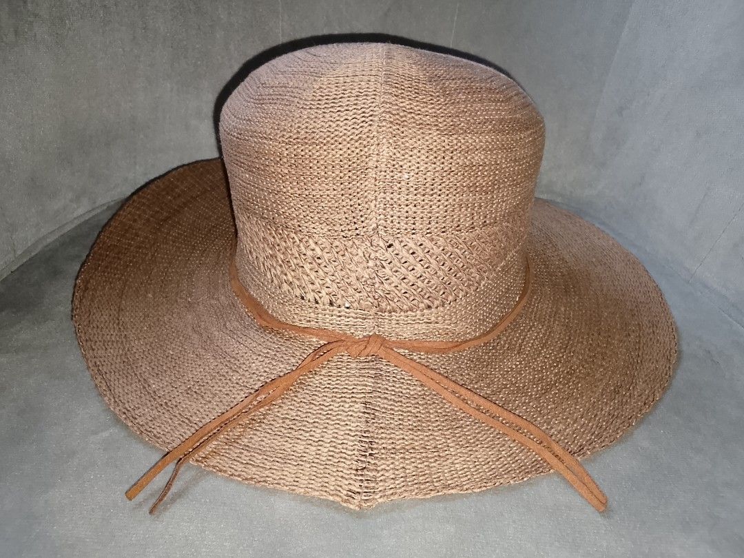 Woven Sun Hat with Leather Strap Detail (Category: Hats & Beanies) located in Binangonan. Submitted by yuristalin888 (Listing ID 1453325806, Image 3). Description: - Light brown woven sun hat - Wide brim for excellent sun protection - Braided texture for a stylish look - Decorative leather strap around the crown - Leather strings for adjustable tie closure - Ideal for beach trips and everyday casual outings.